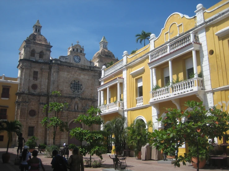 a yellow and white building with many windows