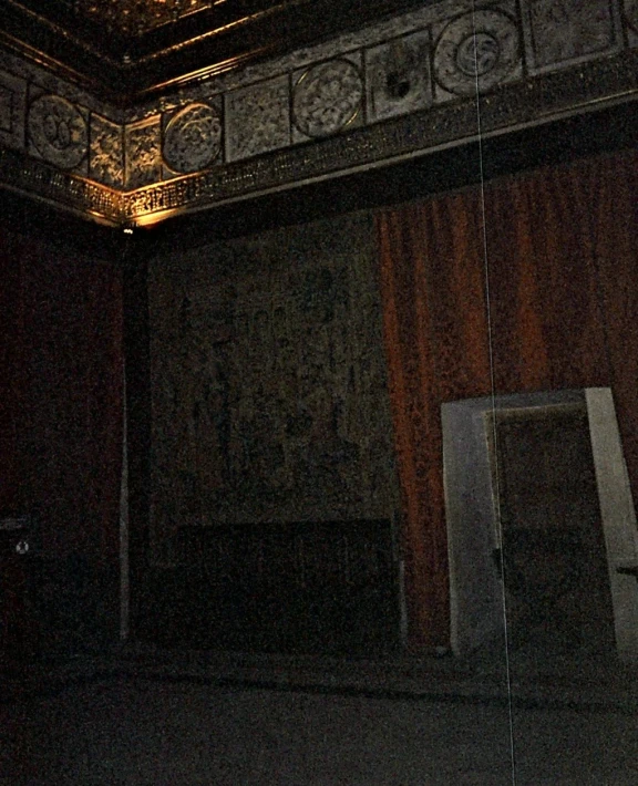 a dark room is lit up with a light on the ceiling