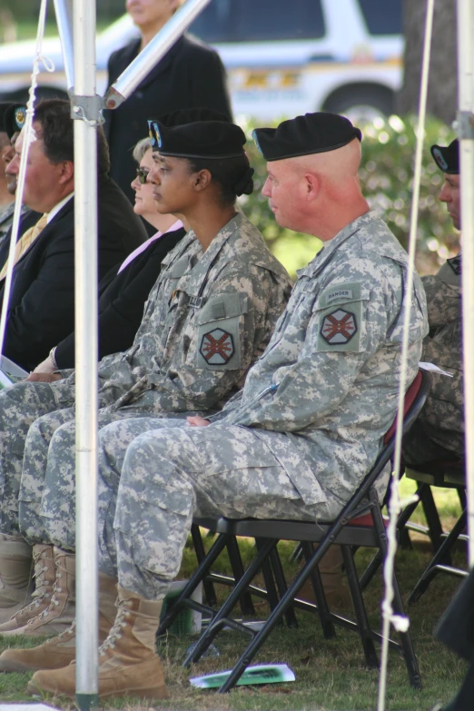 a couple of soldiers are sitting in chairs