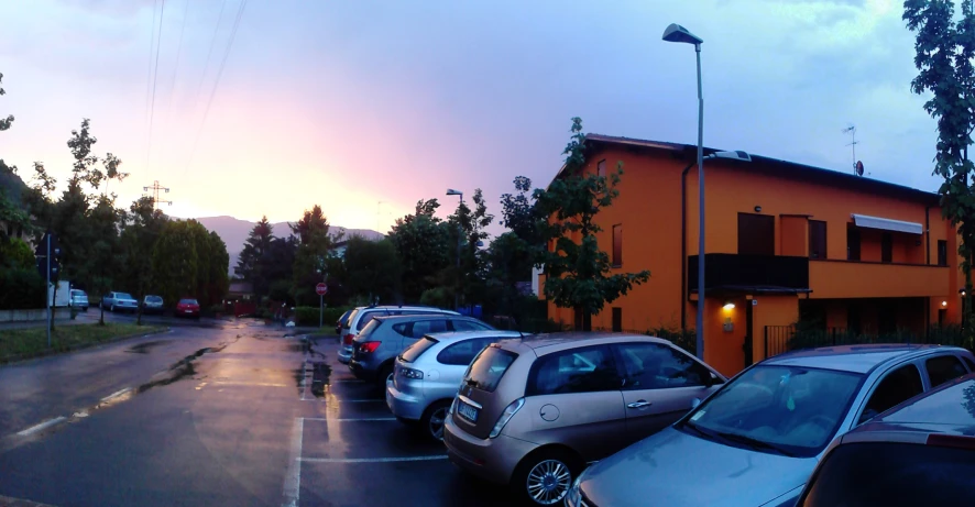 cars line up parked in a parking lot