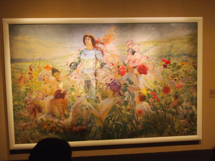 there is a large painting on display inside the building