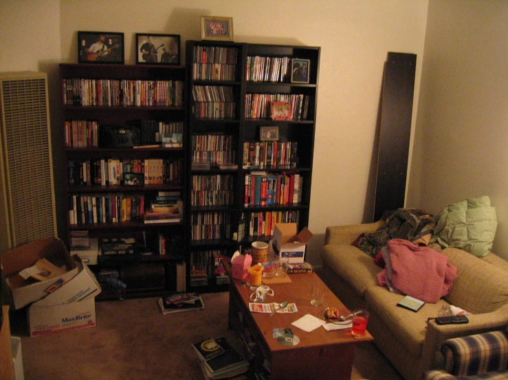 an open living room door with several bookshelves full of dvds