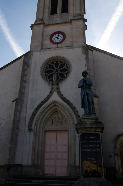 a stone building with a clock mounted to it's side