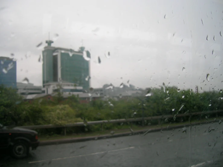 rain fell on cars driving down the road