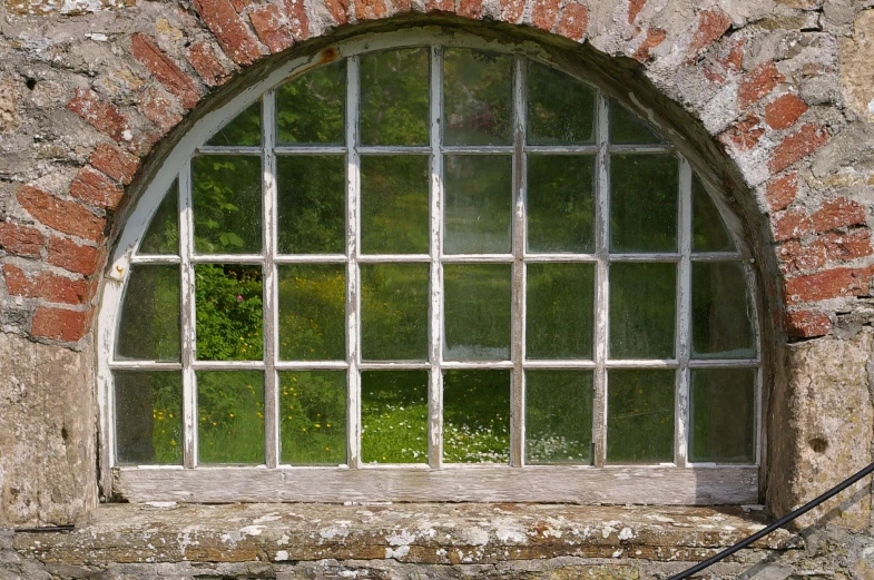 an old window set in a brick wall