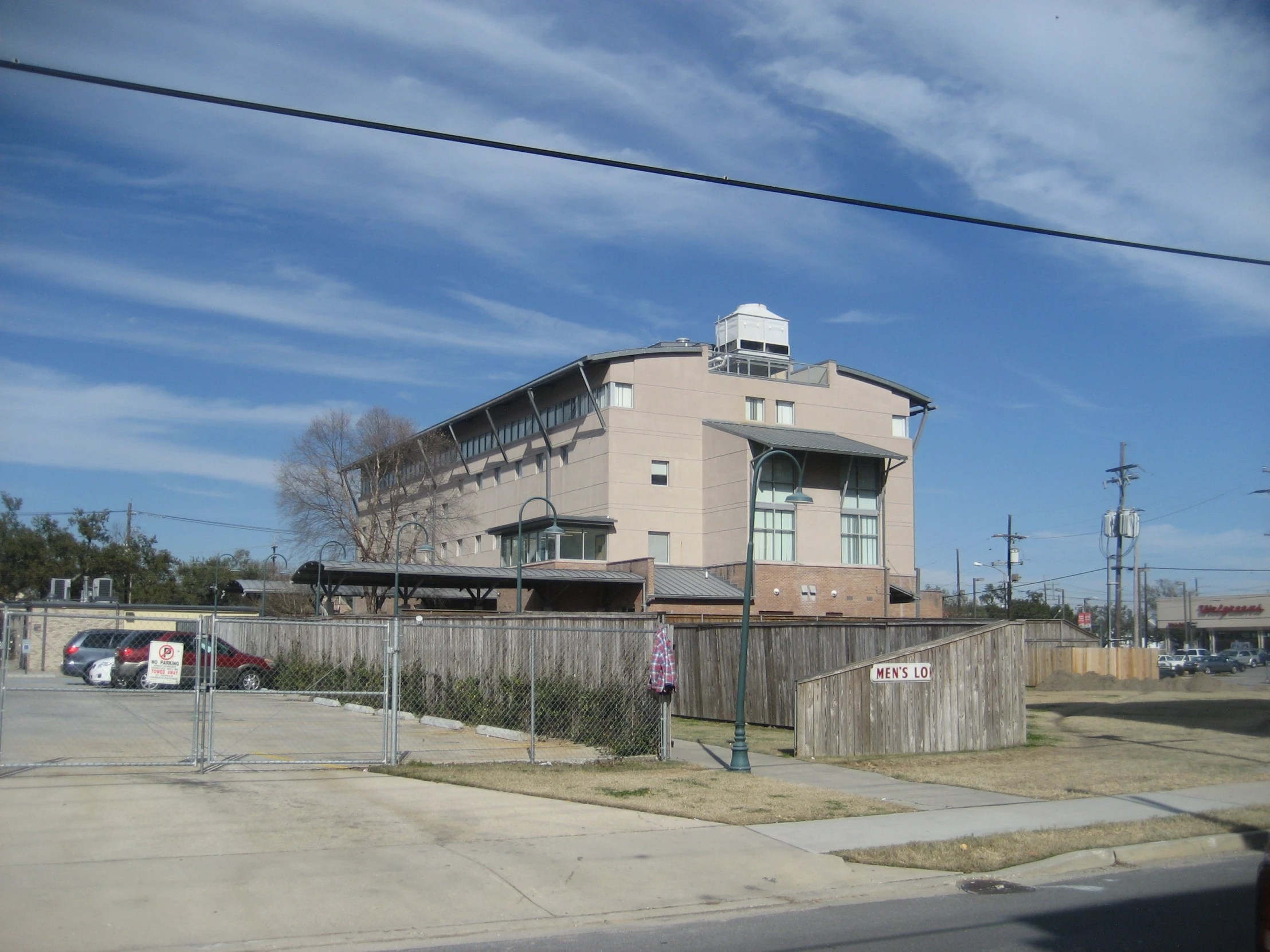 an older building sits on the edge of a neighborhood