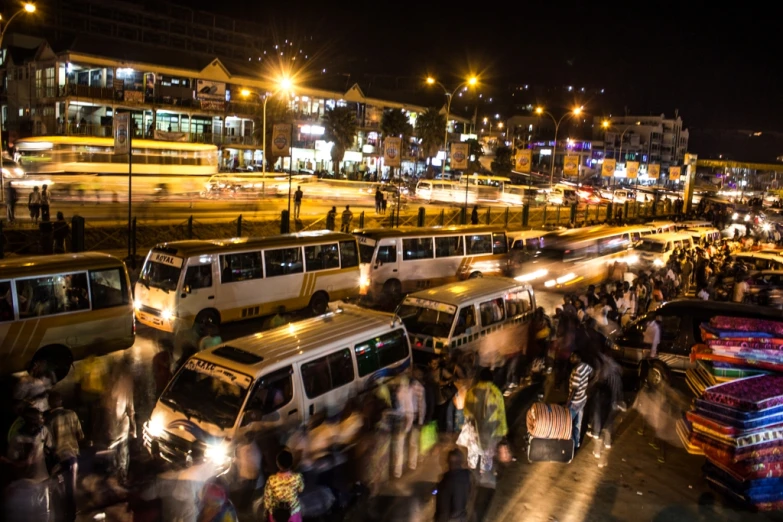 a busy city street at night filled with vehicles