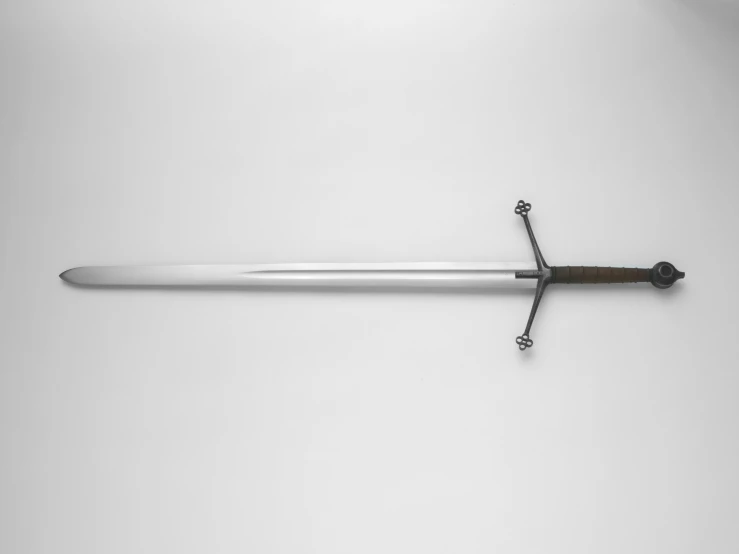 a sword sitting on top of a wall with it's handle wrapped around a chain