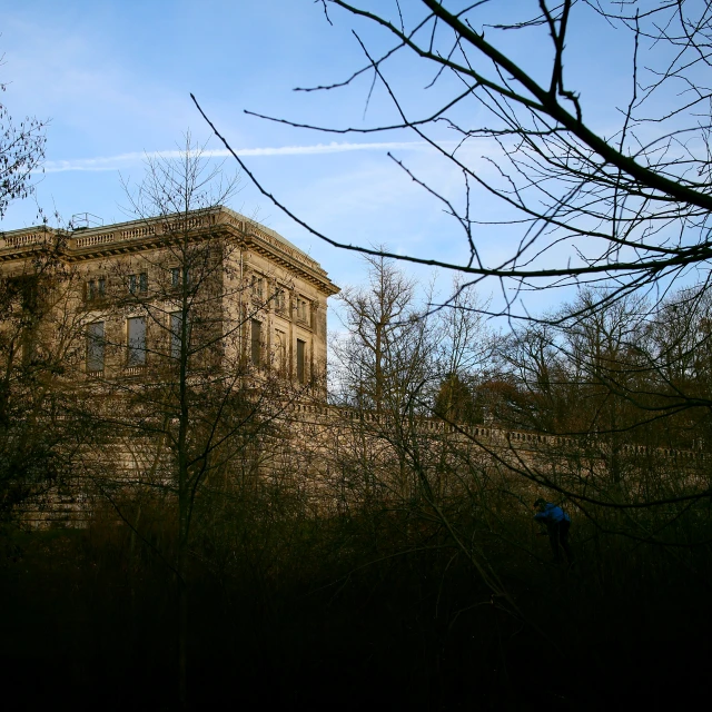 an old building in a field with no trees