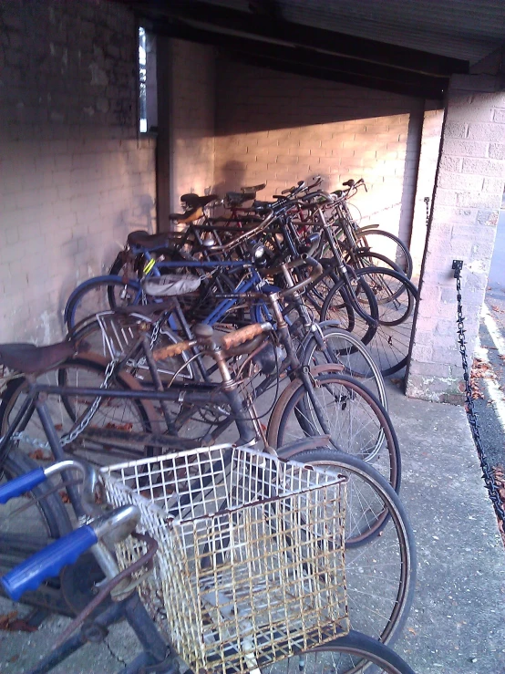 several bikes parked inside of an open garage