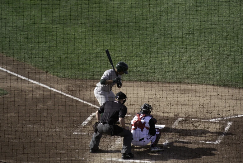 there is a baseball player at the plate with the bat up