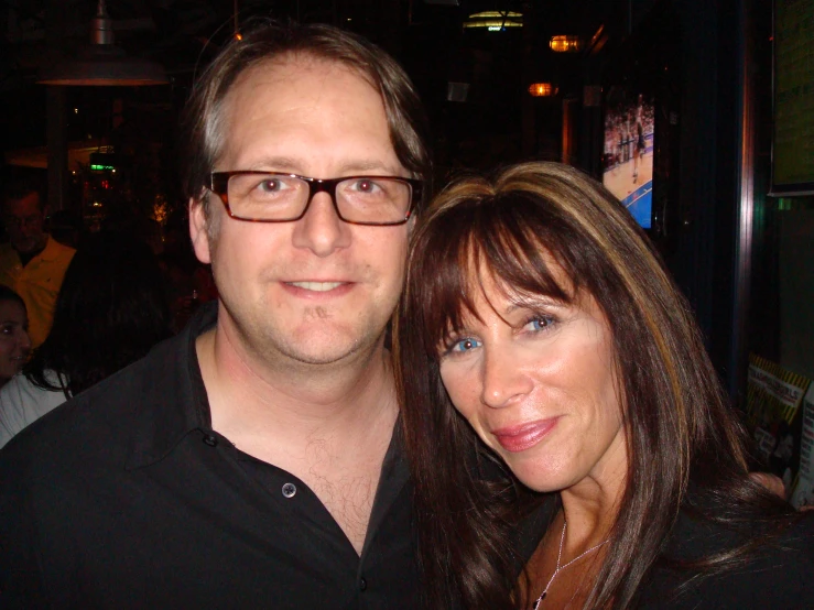 two people at a party posing for a picture