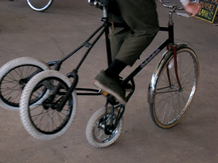 the legs and feet of a person riding a bike