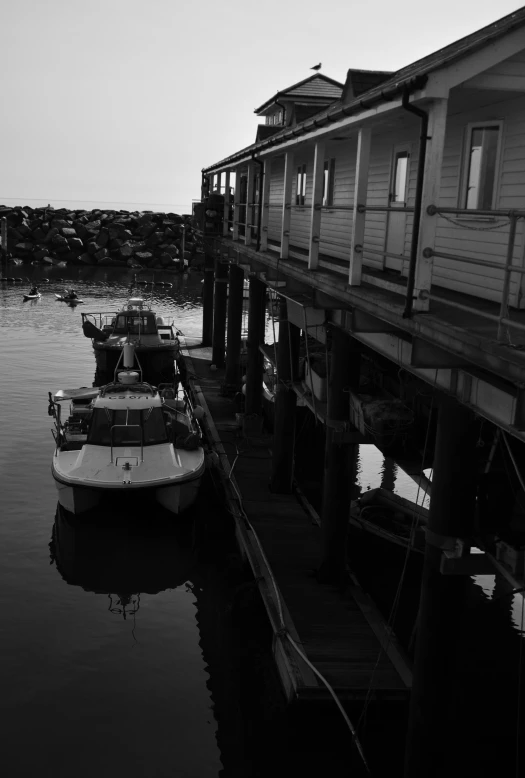 small boats tied to a dock in the water