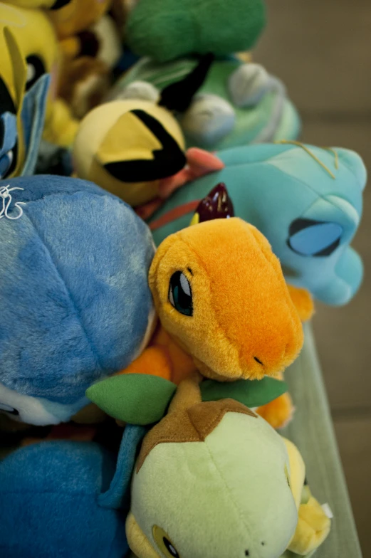 a pile of stuffed animals sitting next to each other