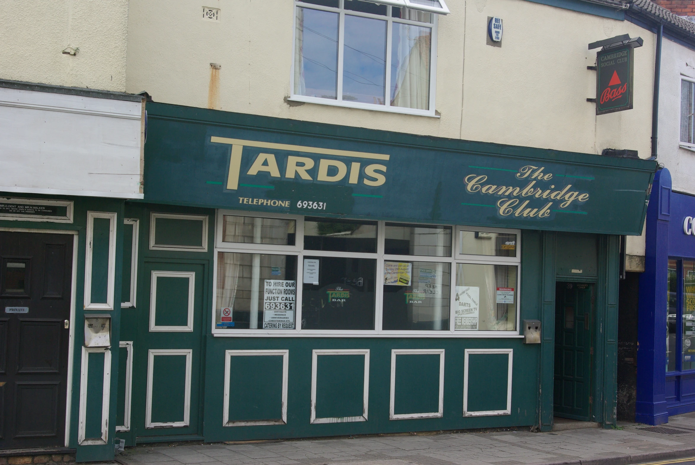 a building with closed front doors and sign reading yardis