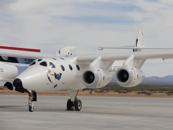 the front wheels of a jet that is on a runway