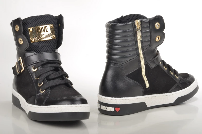 black high top sneaker with gold zipper and metallic logo