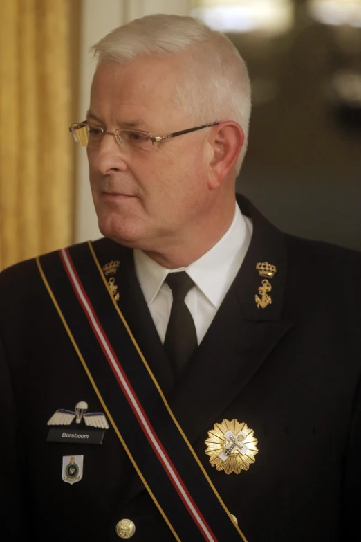 a man in a black military uniform looking away