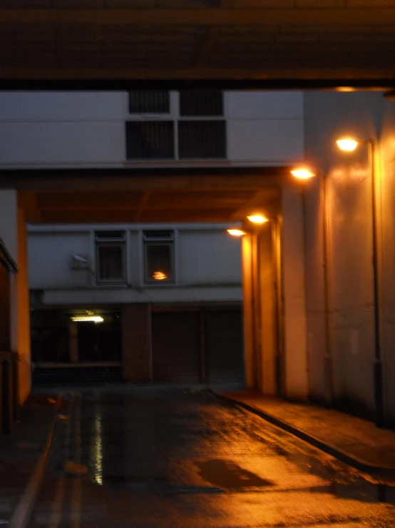 a large parking garage with a bunch of light on the outside