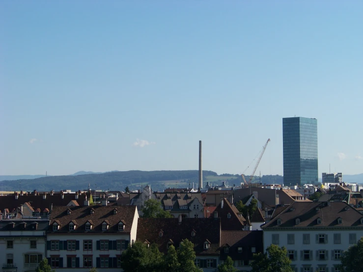 large skyscrs and a tall building stand in the distance