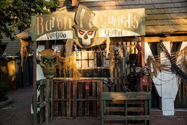 several horses are displayed outside a store on the sidewalk