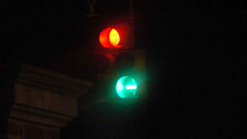 a close up of two stop lights on a building