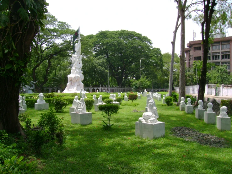 an outdoor cemetery that is surrounded by many statues