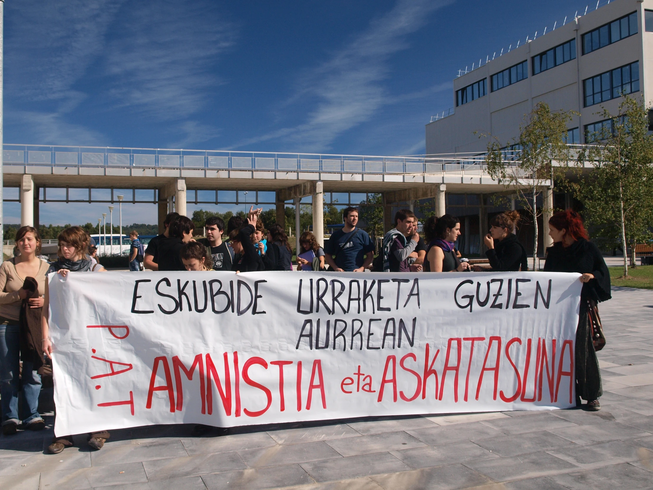 a group of students holding up a banner