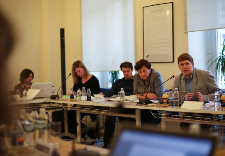 a group of people sitting at a table