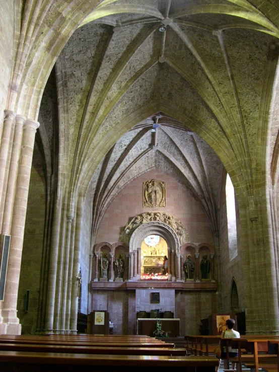 a church is shown with pews and a high ceiling