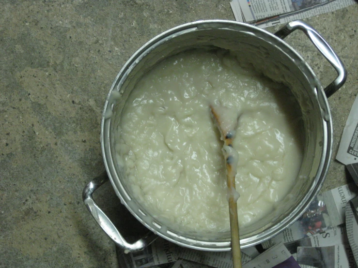 a large pot with soup in it sits on the counter