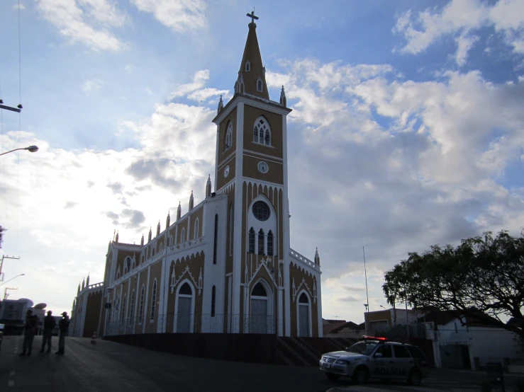 a tall church tower with a clock at the top