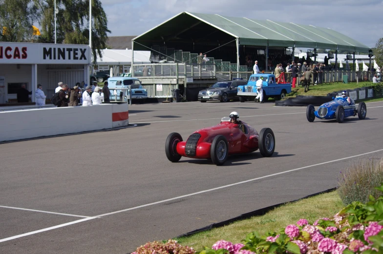 race cars make their way along the track during a race