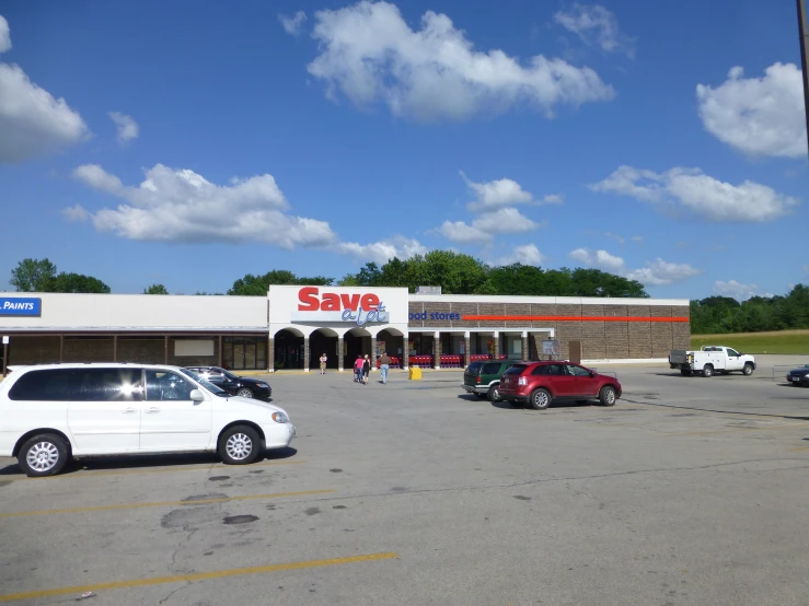 the building at the end of the parking lot has an open space for business