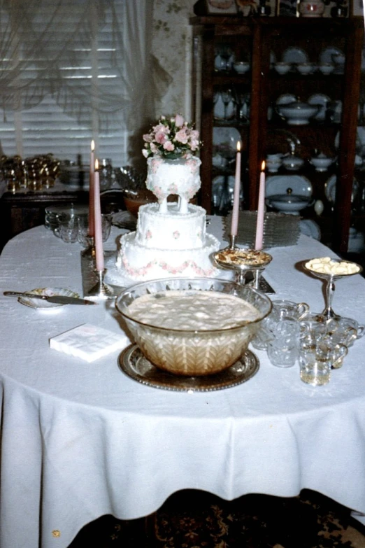 an elegantly decorated dining table is shown with plates