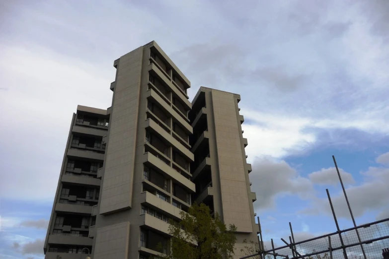 an odd building that appears to be being constructed on the outskirts