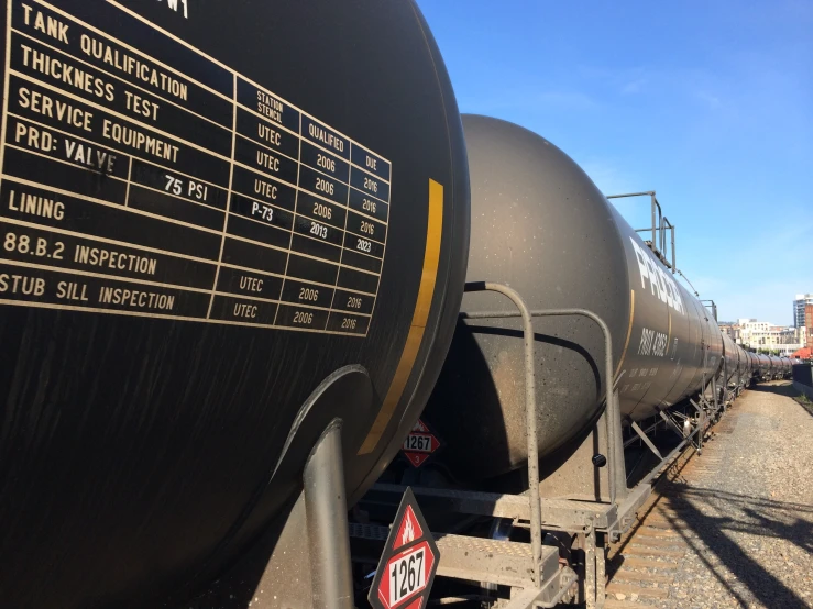 a large train on a steel track near another train