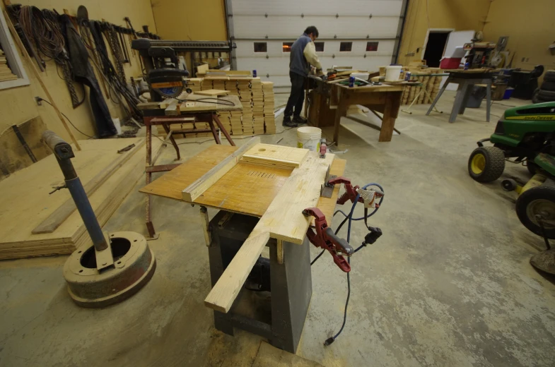 an open shop with many wooden work benches