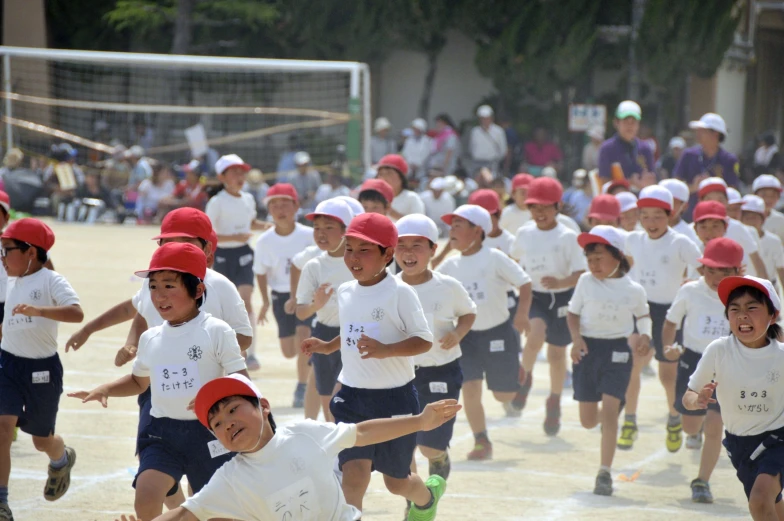 children race toward an intersection on the field
