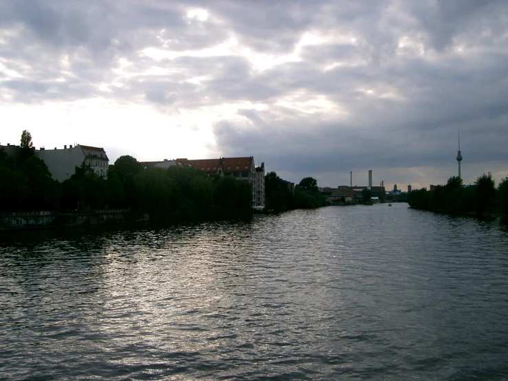 a long dark river running into a town