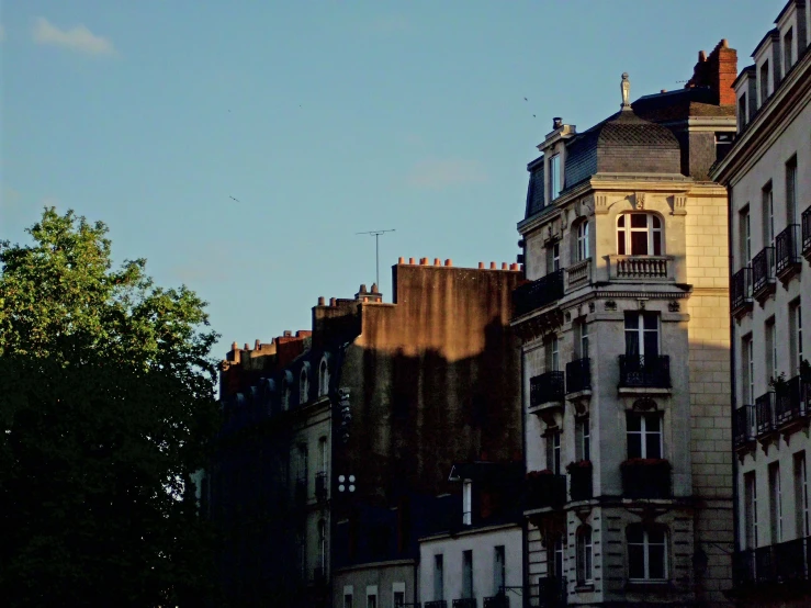 the silhouette of buildings on the left side of the image