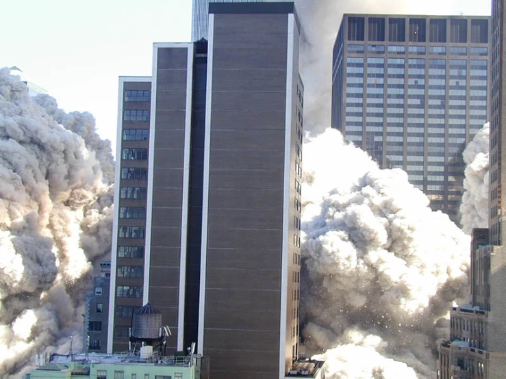 an explosion is in front of a building that has smoke from it