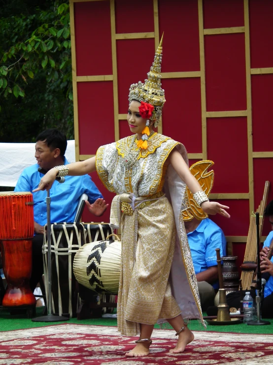 some people are performing with large musical instruments