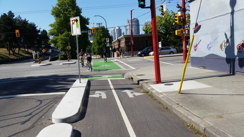 a bike lane on a city street next to a traffic light