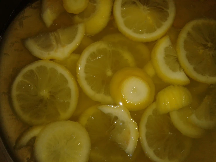 a pitcher filled with water topped with lemons