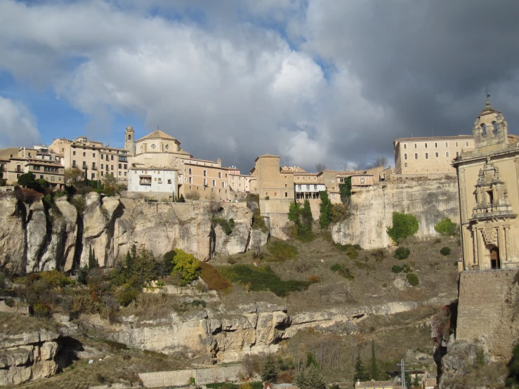 a city with many buildings on the top of the mountain