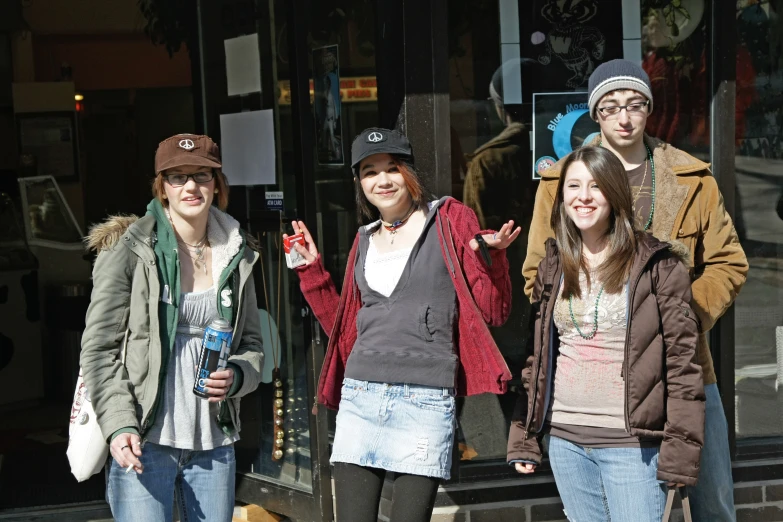 a group of young people standing next to each other