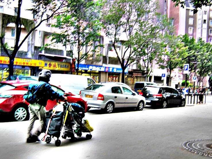 there are two people hing a stroller on the street