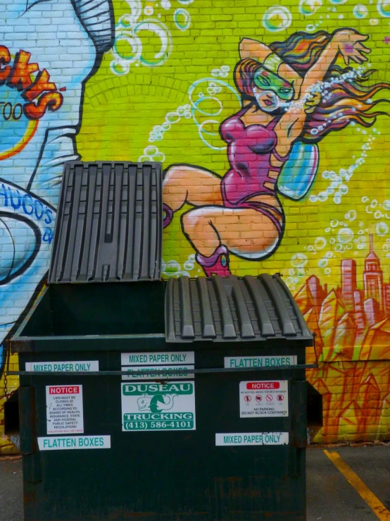 a woman on the side of a building with a mural